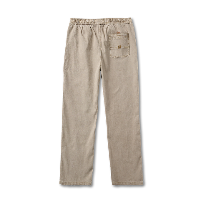 Close-up view of khaki pants detailing with pocket and button, perfect for adventure and travel