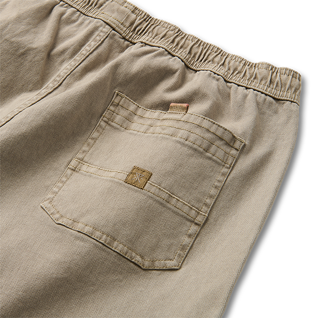Versatile khaki pants by Roark, perfect for travel and outdoor adventures