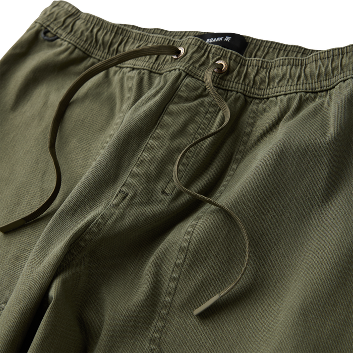 Adventurous individual exploring a scenic outdoor trail, embodying Roark's spirit of adventure and travel.