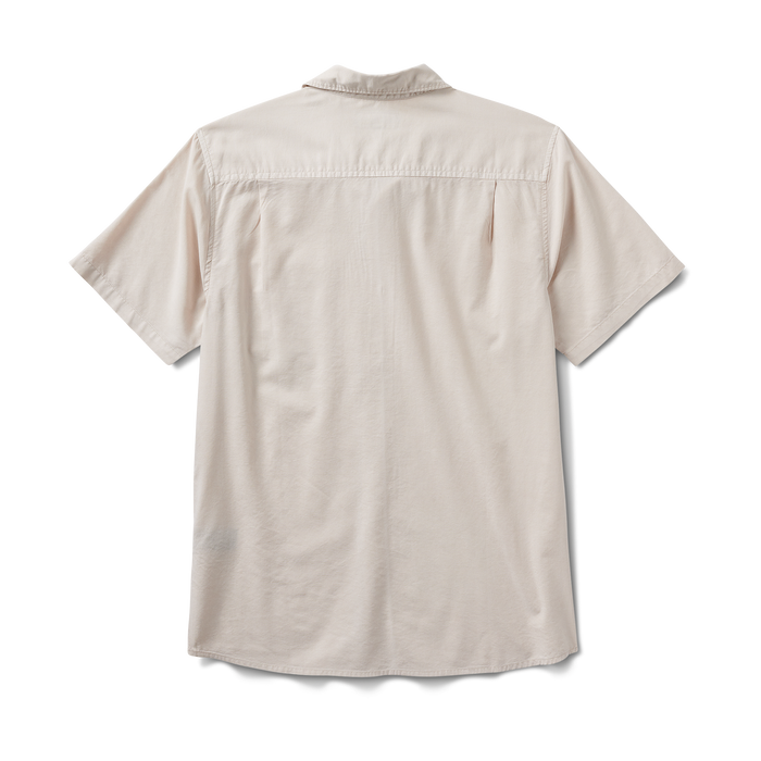 Back view of the Roark Made To Fade Short Sleeve Button Up Shirt in Washed Bone, showcasing its lightweight fabric and relaxed fit.