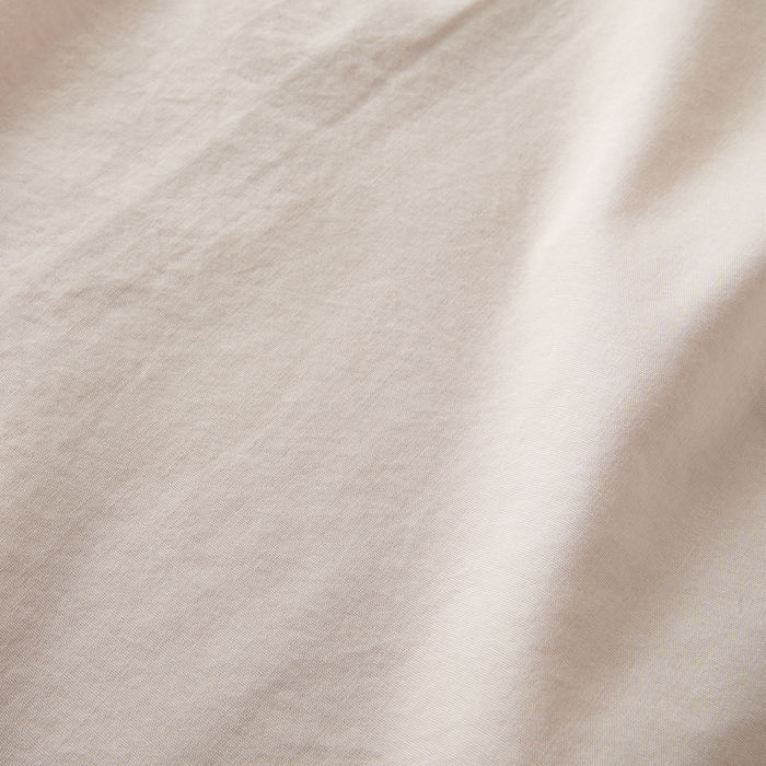 Detailed texture of the Roark Made To Fade Short Sleeve Button Up Shirt in Washed Bone, highlighting its breathable and soft fabric.