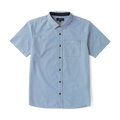 Close-up of a rugged denim dress shirt featuring durable buttons and a crisp collar, ideal for adventure and travel.