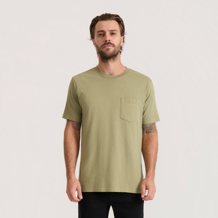 Sage green short sleeve tee with chest pocket worn by man against neutral background
