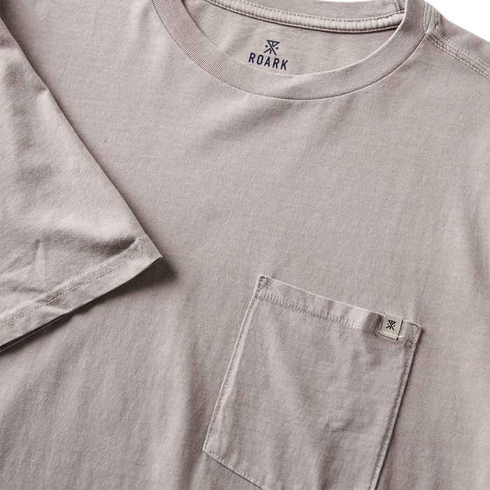 Close-up of the premium grey t-shirt showing the stitched chest pocket and durable cotton fabric for everyday wear.