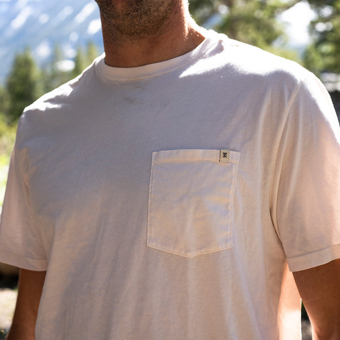 Roark Made to Fade Tee from Fall Collection 2025 displayed in an adventurous outdoor setting.
