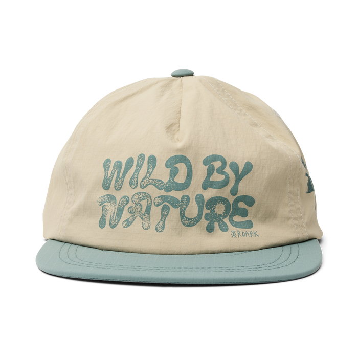 Outdoor-focused apparel by Roark, model RH748 in oat color, displayed in a natural setting to evoke the spirit of adventure and travel.
