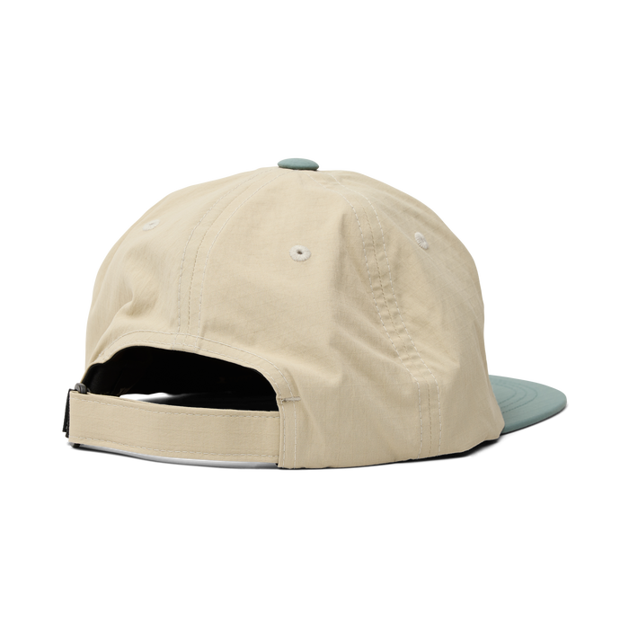 Stylish Roark cricket cap in oat color, perfect for outdoor adventures and casual travel wear
