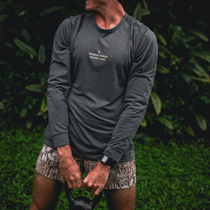 Active man wearing a Mathis long sleeve tee by Roark, ideal for sportswear and outdoor activities.
