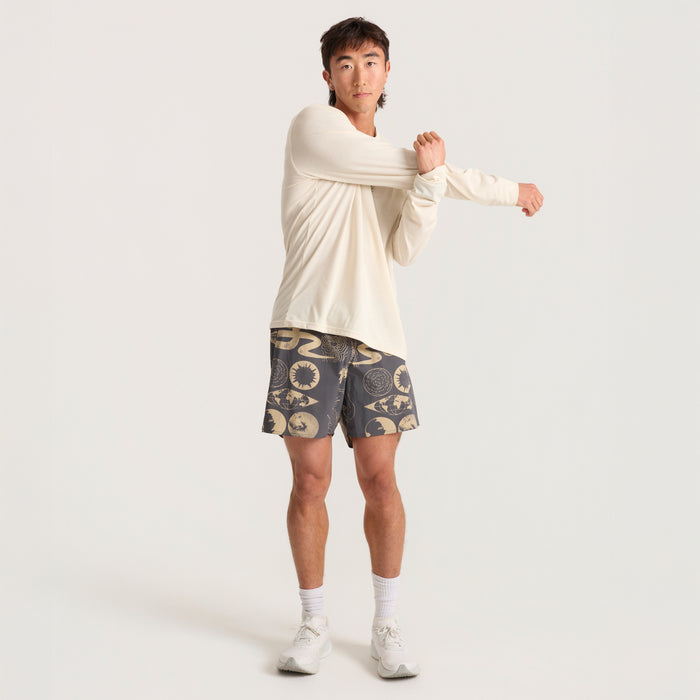 Model wearing versatile Roark active shorts, ideal for running and outdoor adventures