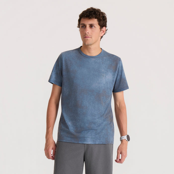 Mathis Active Allover short sleeve tee in dark slate blue worn by man on neutral background, front view