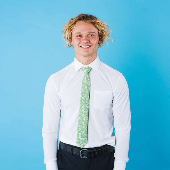 Green floral patterned tie on a white shirt