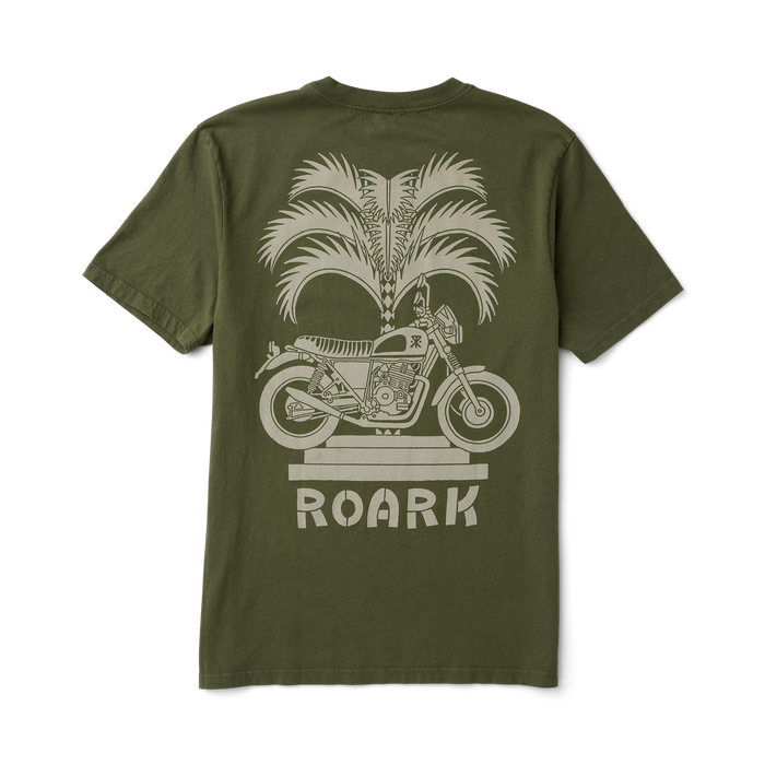 Adventurous biker wearing a versatile Roark active shirt while riding a motorcycle through a scenic route