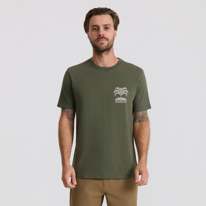 Active shirt designed for adventure and travel by Roark, showcased in a dynamic outdoor setting.