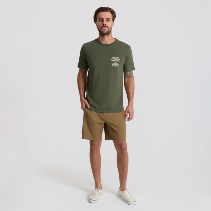 Assorted Roark active and board shorts displayed in a vibrant, outdoor adventure setting, perfect for travel and exploration.
