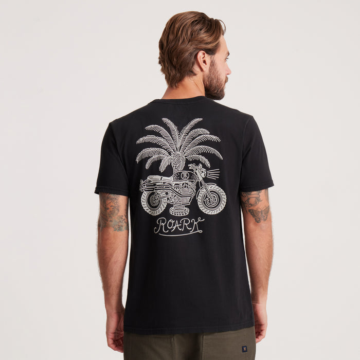 Back view of the Roark black graphic tee with a detailed motorcycle and palm tree graphic, inspired by the spirit of exploration and the open road.