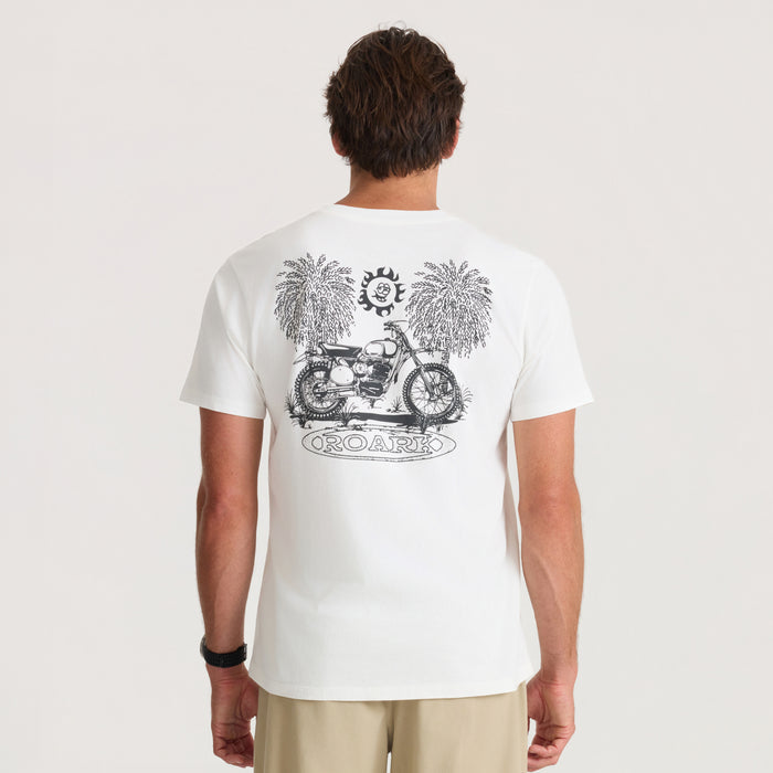 White short sleeve t-shirt with black motorcycle and palm tree graphic print on back, shown on male model from rear view