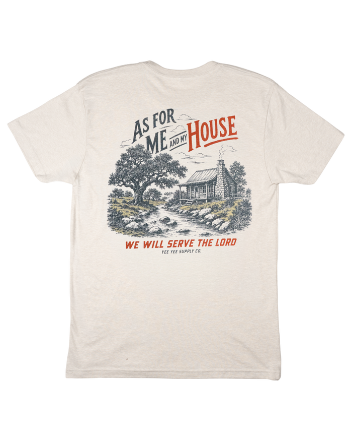 White t-shirt with a graphic design and text on the back, featuring a cabin and tree.