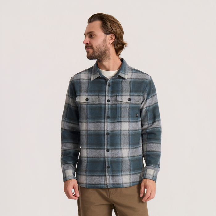 Nordsman 2.0 long sleeve flannel in dark slate plaid worn by man over white tee with khaki pants