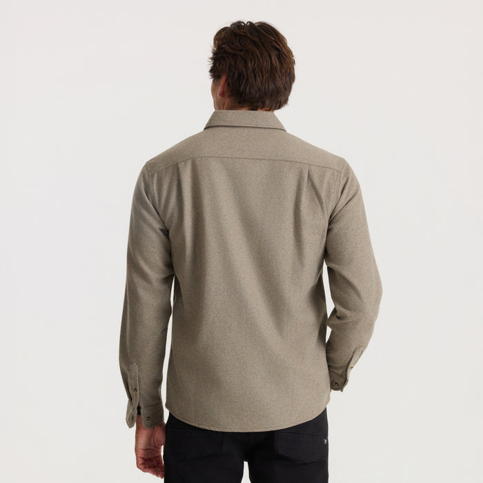 Man wearing dusty green Nordsman 2.0 long sleeve flannel shirt, back view against neutral background