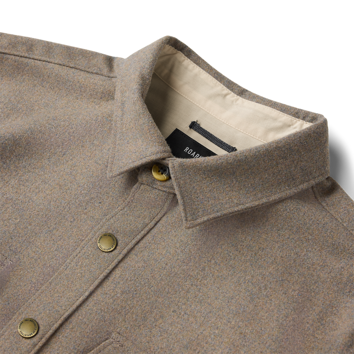 Dusty green Nordsman 2.0 long sleeve flannel with brass snap buttons and cream interior collar detail, close-up view
