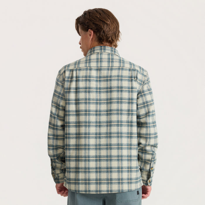 Nordsman 2.0 long sleeve flannel in sand with blue plaid pattern, shown from back on model wearing light blue pants
