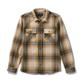 Close-up of a rugged denim and tartan plaid pocket, showcasing durable textiles perfect for adventure and travel.