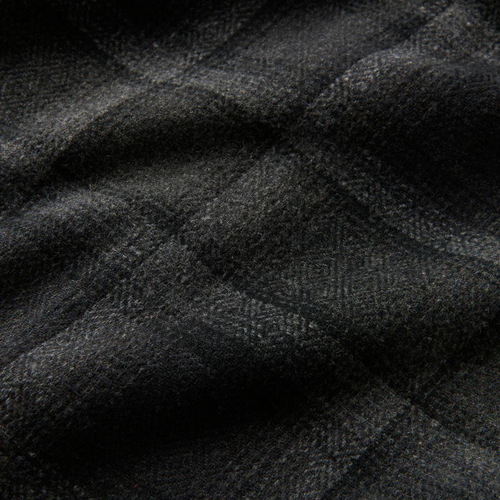 Durable woven fabric and leather details in monochrome grey, perfect for Roark’s adventure gear.