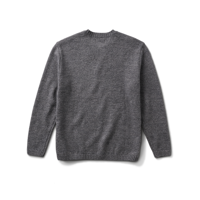 Close-up of a grey, long-sleeved woolen t-shirt, ideal for outdoor and adventure travel, showcasing the texture and quality of the fabric.