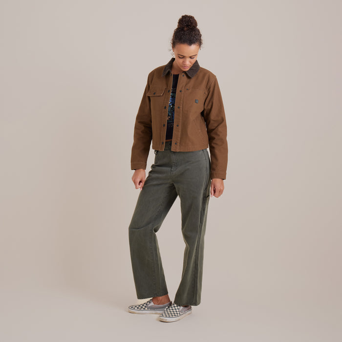 Close-up detail of Roark's Open Roads canvas jacket showcasing rugged denim texture with prominent collar, button, and pocket features, ideal for outdoor adventures.