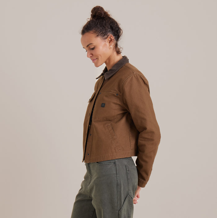 Detail view of the Open Road canvas jacket by Roark featuring rugged buttons and practical pockets, ideal for adventure and travel.