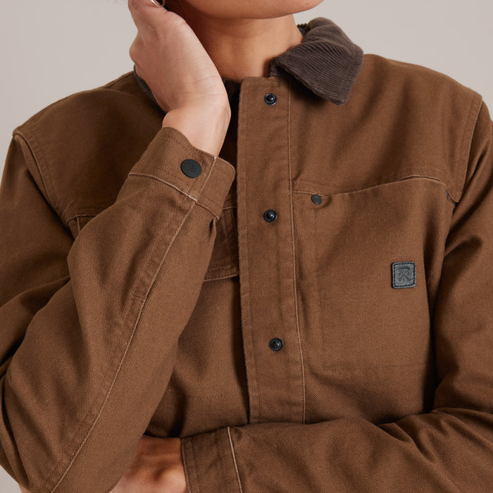 Roark Open Roads Canvas Jacket displayed in a rugged outdoor setting, epitomizing adventure and exploration.