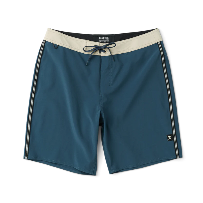 Teal blue boardshorts with cream waistband, drawstring, and white side stripes on flat lay display