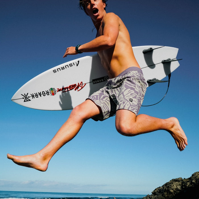 Dynamic surf scene showcasing a surfboard and boardshorts, capturing the essence of water sports and adventure.