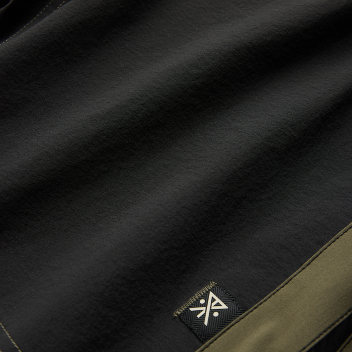 Stylish black Roark adventure gear in an outdoor setting, emphasizing durability and design for travel enthusiasts.