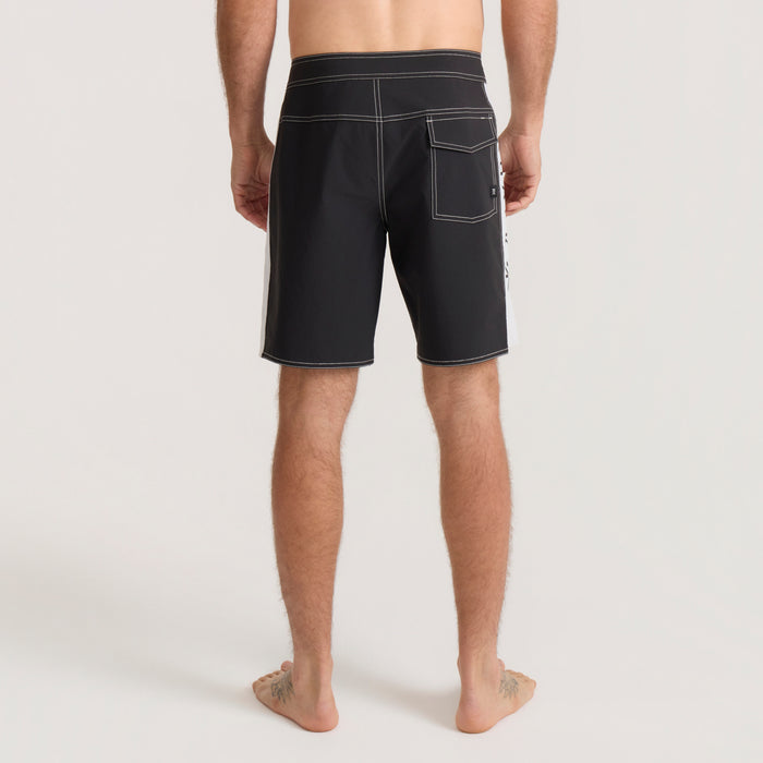 Black boardshorts with white contrast stitching and back pocket, shown on model from behind