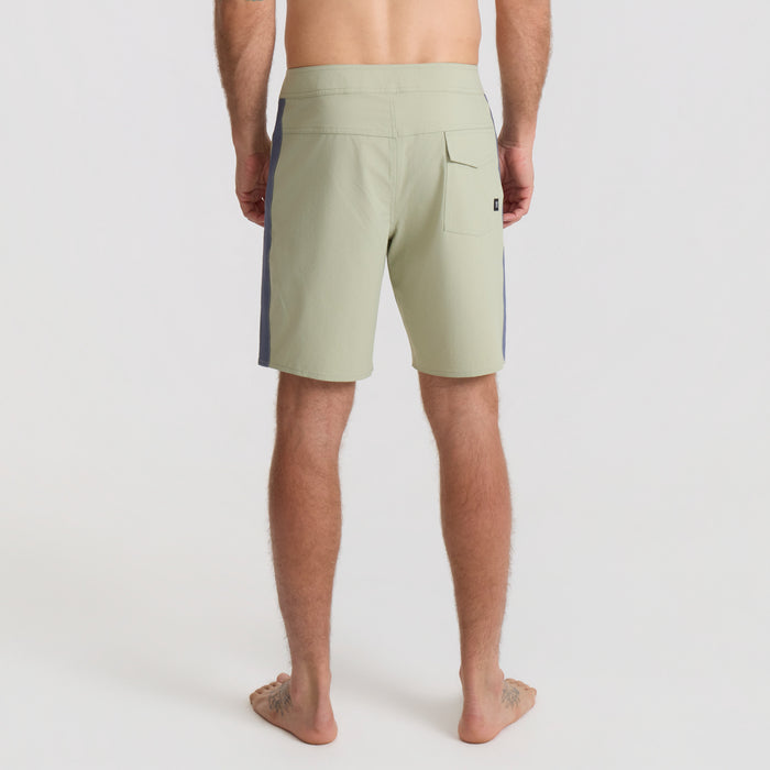 Traveler enjoying leisure time on a scenic coast, embodying Roark's spirit of adventure and outdoor exploration