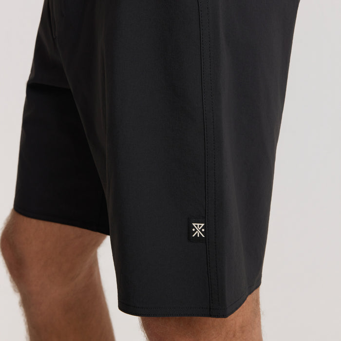 Black Passage Pro Boardshorts with branded logo detail on thigh, shown on model in close-up view