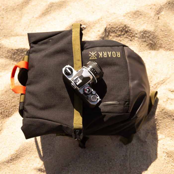 Adventure-ready backpack with durable straps and efficient storage compartments, perfect for travel and outdoor exploration by Roark.