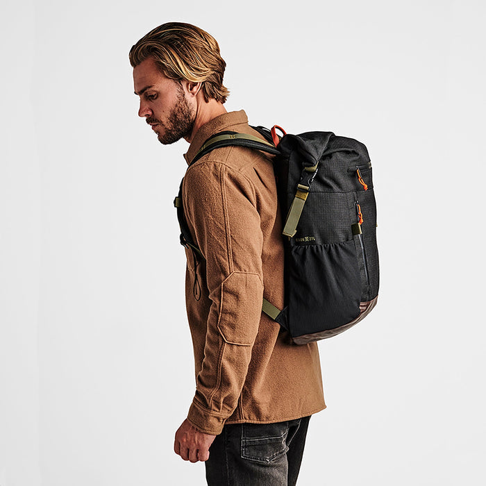 Roark Passenger 27L 2.0 Travel Bag in Black, showcasing a close-up of the bag's front panel.
