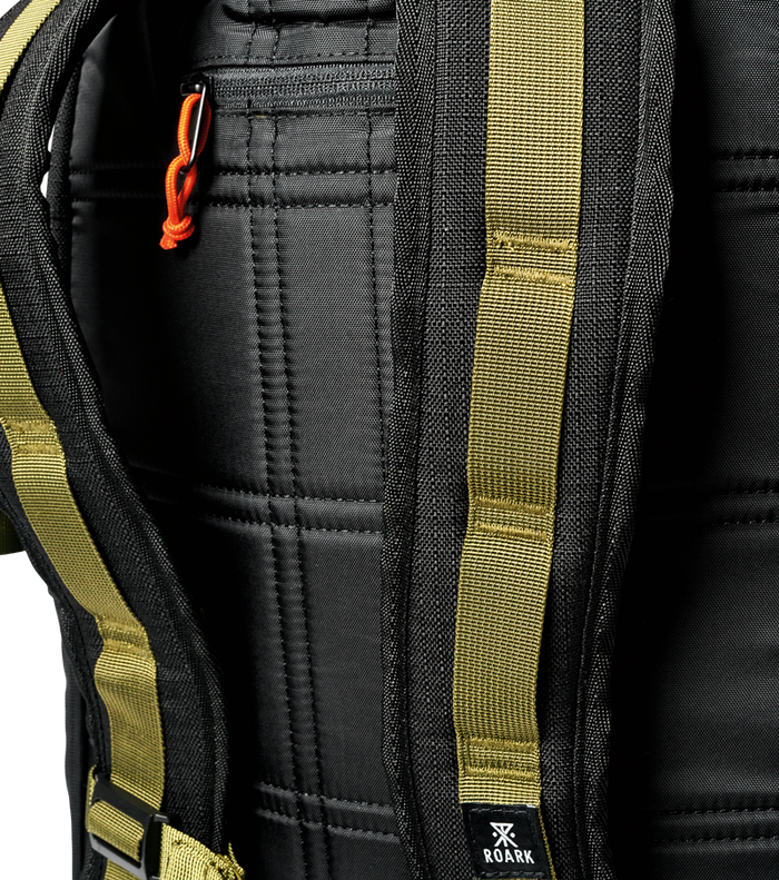 Roark Passenger 27L 2.0 Travel Bag in Black, showcasing a close-up of the bag's side handle.