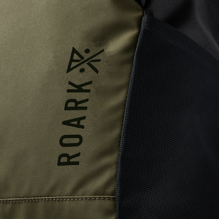 Roark Passenger 27L 2.0 Travel Bag in Black/Military, showcasing a close-up of the bag's side pocket.