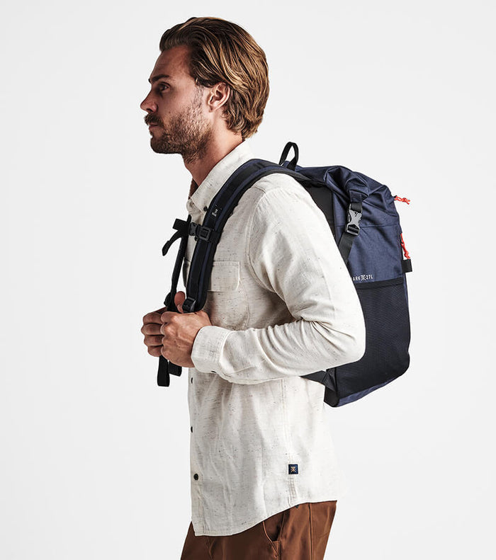 Roark Passenger 27L 2.0 Travel Bag in Blue, showcasing a side view of the bag.