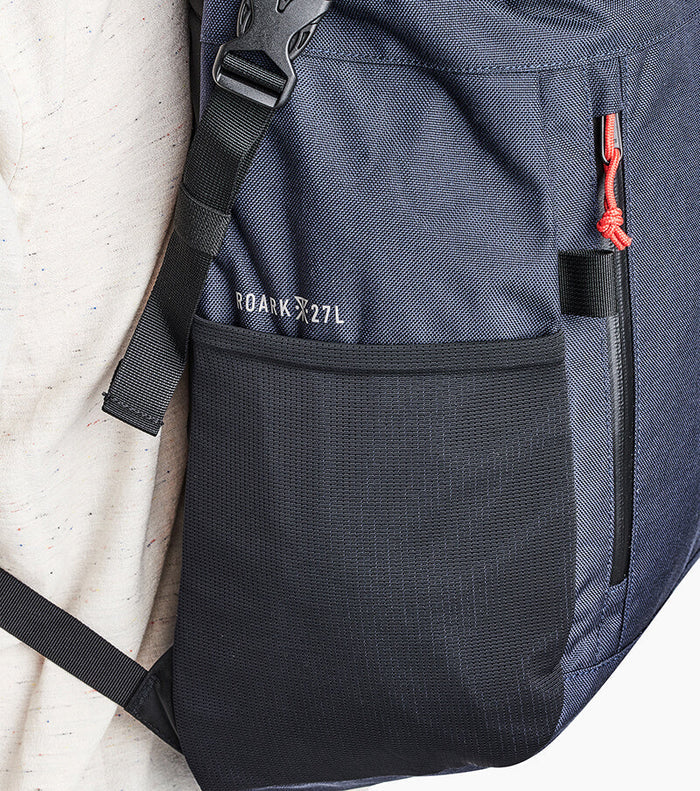 Roark Passenger 27L 2.0 Travel Bag in Blue, a front view highlighting its spacious design and multiple pockets.