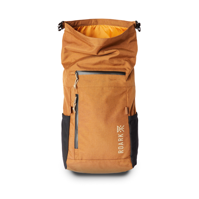 Roark Passenger 27L 2.0 Travel Bag in Toffee, showcasing a close-up of the side pocket, ideal for organizing essentials.