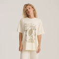 Cream oversized t-shirt with "Plant Seeds for Inner Growth" botanical graphic and butterfly design, worn by model against neutral background