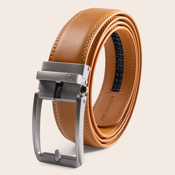 Tan brown leather belt with silver buckle on a light beige background