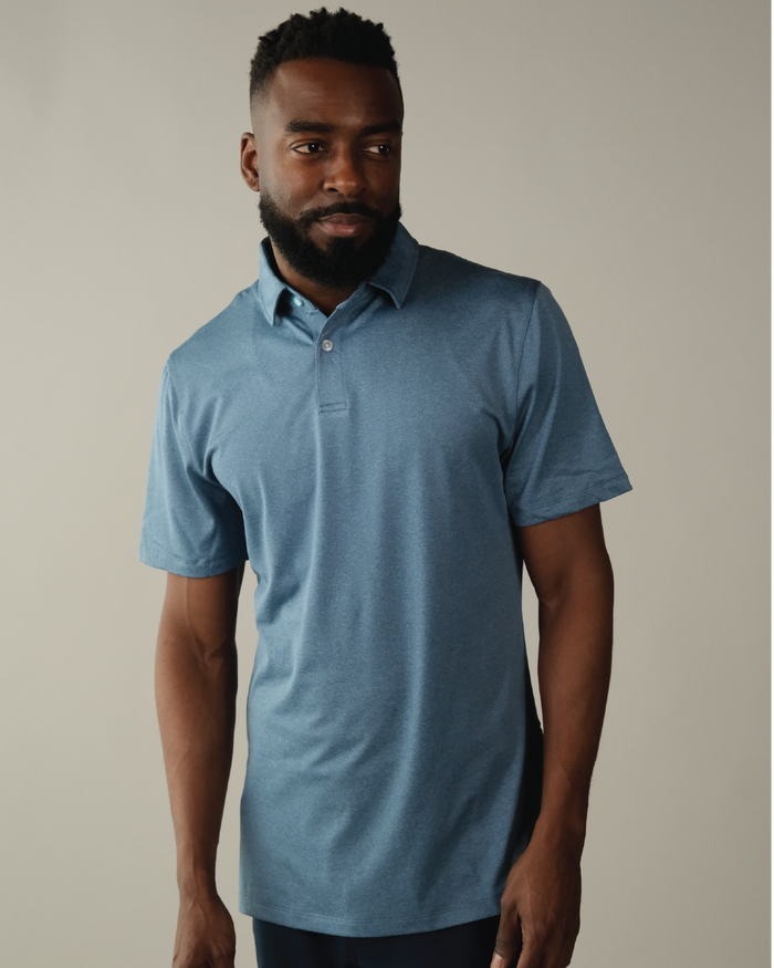 Man wearing a heather blue polo shirt