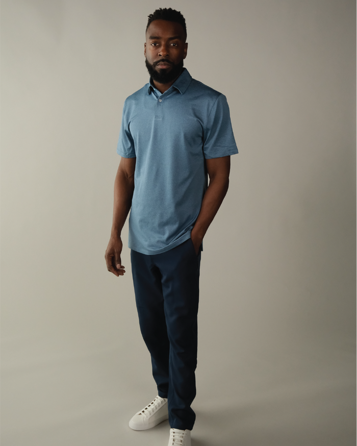 Man wearing a heather blue polo shirt