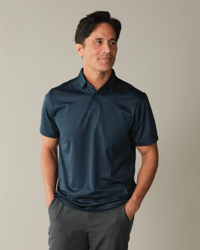 Man wearing a midnight navy polo shirt