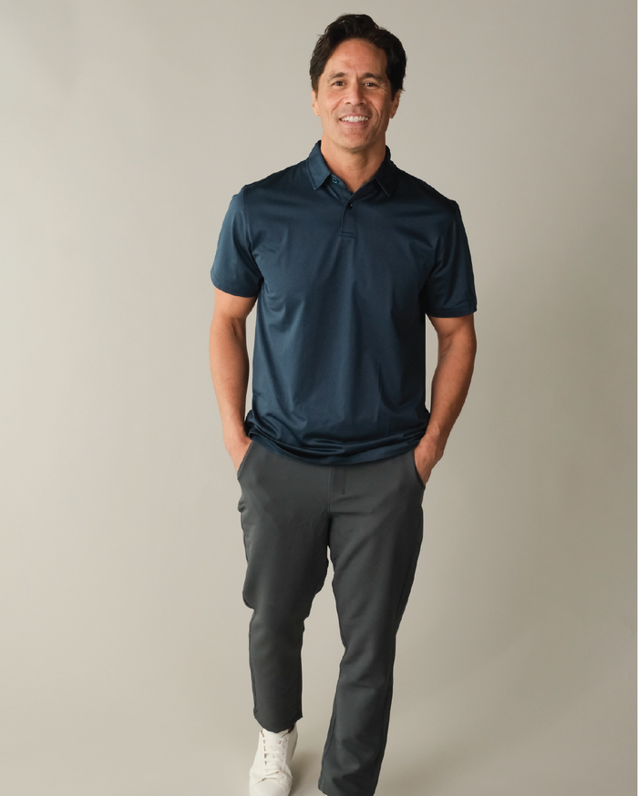 Man wearing a midnight navy polo shirt